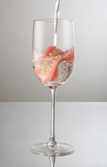 artificial Teeth on wine glass, with water