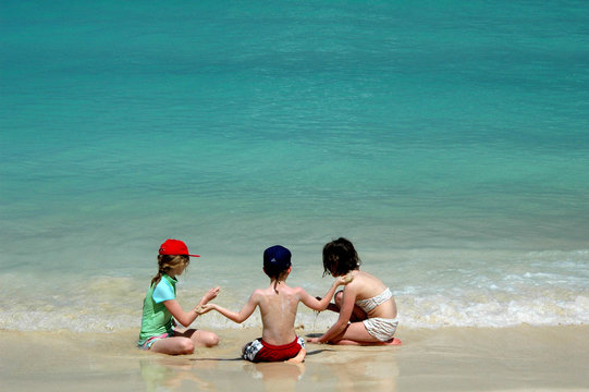 group of children playing on tropical beach