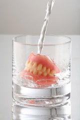 artificial Teeth on glass with water