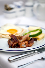 Delicious hotel breakfast with bacon and eggs
