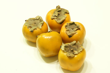 Fresh sharon fruit or persimmon isolated on white background