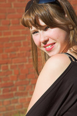 Fototapeta premium The young beautiful smiling girl 