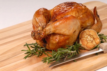 Whole roasted chicken with garlic and rosemary
