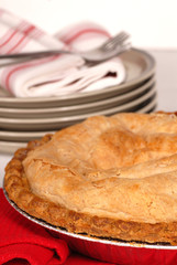Fresh baked whole apple pie with a flaky crust