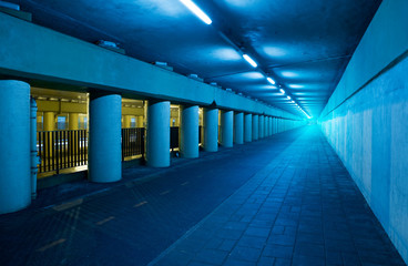 Long blue tunnel with light at the end..
