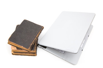 laptop and old law books on white background