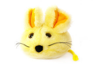 yellow soft toy of a small mouse on white background