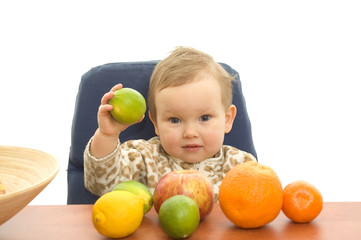 Fototapeta premium Baby and fresh fruits on table isolated background
