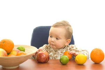 Fototapeta na wymiar Baby and fresh fruits on table isolated background