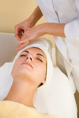 Fototapeta na wymiar Facial cryogenic massage in spa salon