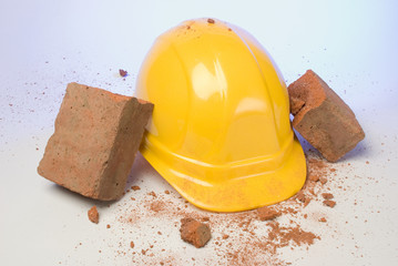 depiction of a hardhat breaking the fall of a brick