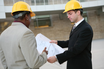 Handsome men working on a construction site