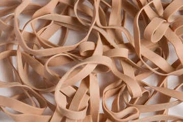 a pattern of rubber bands on a white seamless background