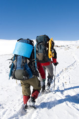Tourists are in winter in mountains