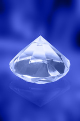 A big diamond with blue light reflections