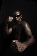 Fototapeta na wymiar aggressive afromerican man with sunglasses - isolated 