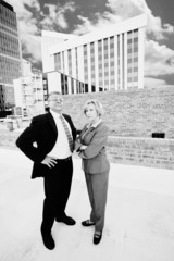 Executive man and woman on a downtown roof