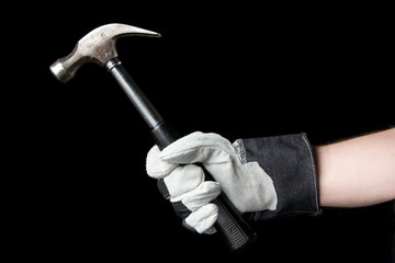 Hammer in hand. Isolated on a black background.