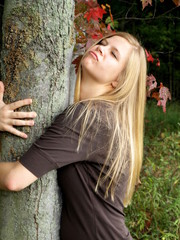 woman hugging a tree