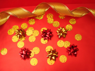 red and golden bows and celebration ribbon