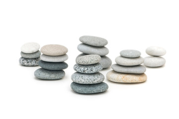 Stacks of pebbles isolated on the white
