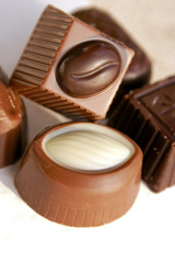 Macro of some mixed filled chocolate candies with copy space.