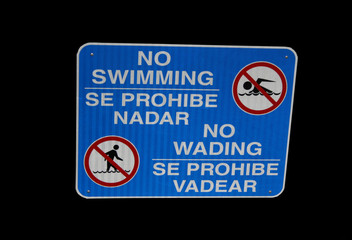 Bilingual no swimming sign