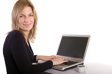 Fototapeta premium attractive young woman working on laptop on white background