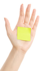 Isolated female hand with the sticky note