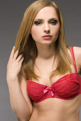 beautiful blonde model wearing pink bra