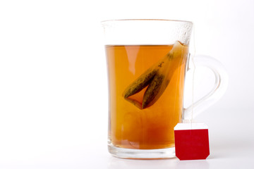 a cup of hot black tea on white