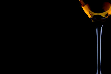 full wine glass on the black background