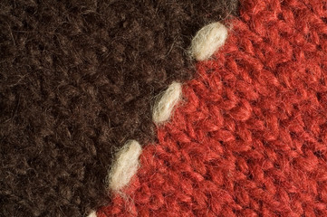 Two halves of red and black woolen cloth