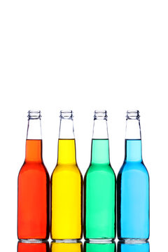 glass bottles with reflection and different colors isolated