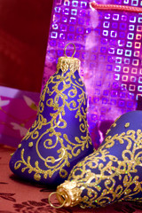 violet Christmas bells on red background