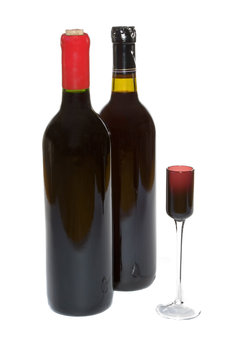 Red wine bottles and a small cordial glass