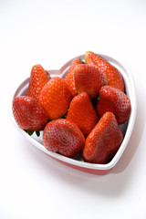 Strawberry in plastic box heart shape