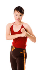 woman in red tank top in a bare fist boxing pose