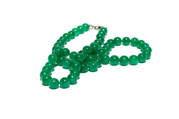 green bracelet on the white isolated background