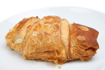 Croissant with sweet filling and almond flakes