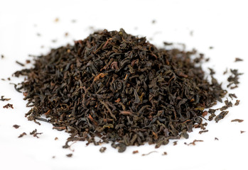Handful of black tea leaves on white background