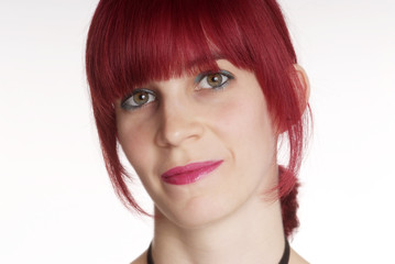 a young woman with red hair and smile