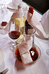 The served table with red and white wine at restaurant.