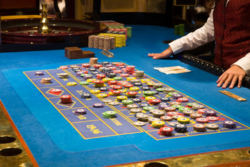 Fototapeta premium croupier preparing and counting money on roulette casino