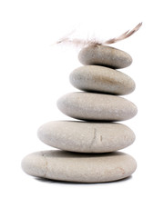 Fototapeta na wymiar five Zen stones with feather