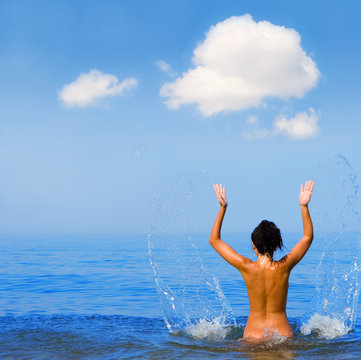 Pretty young woman on the sea.