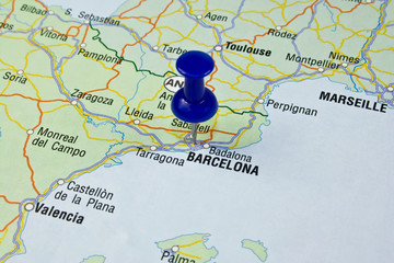 Blue pin pointing on barcelona in europe map