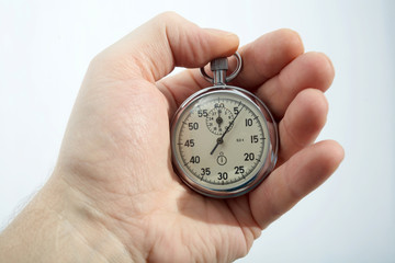 An image of a stopwatch in a hand