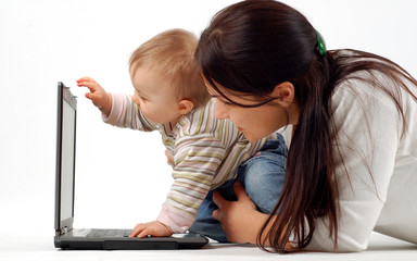 mother and baby girl with laptop