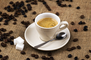 Cup of coffee on coffee sack